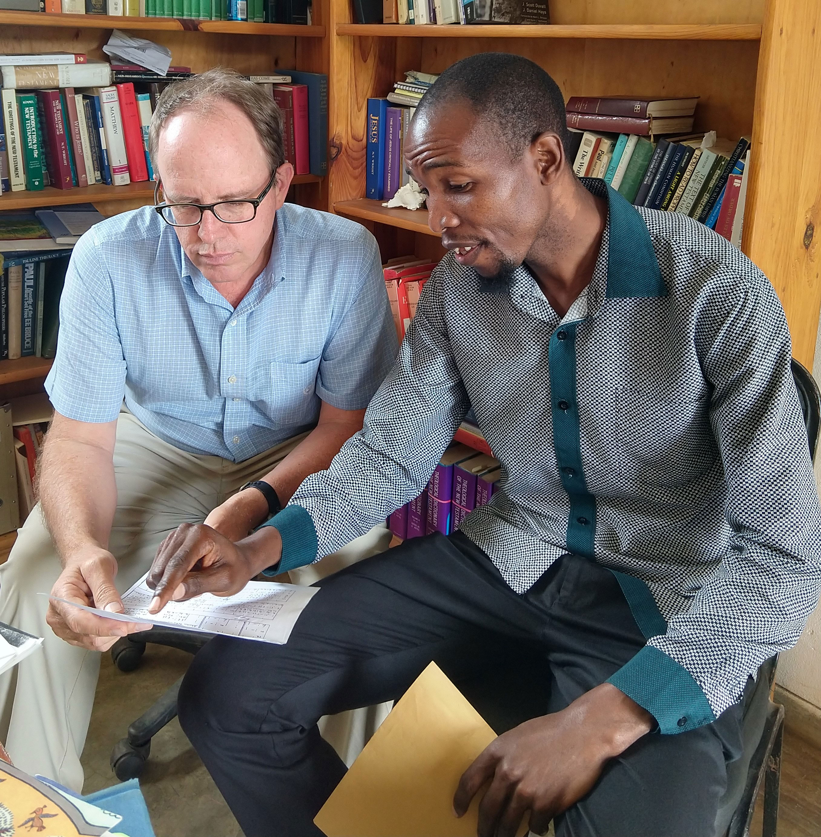 Dustin meeting with a student, Jose Bazima, in Dustin’s office at Justo Mwale University