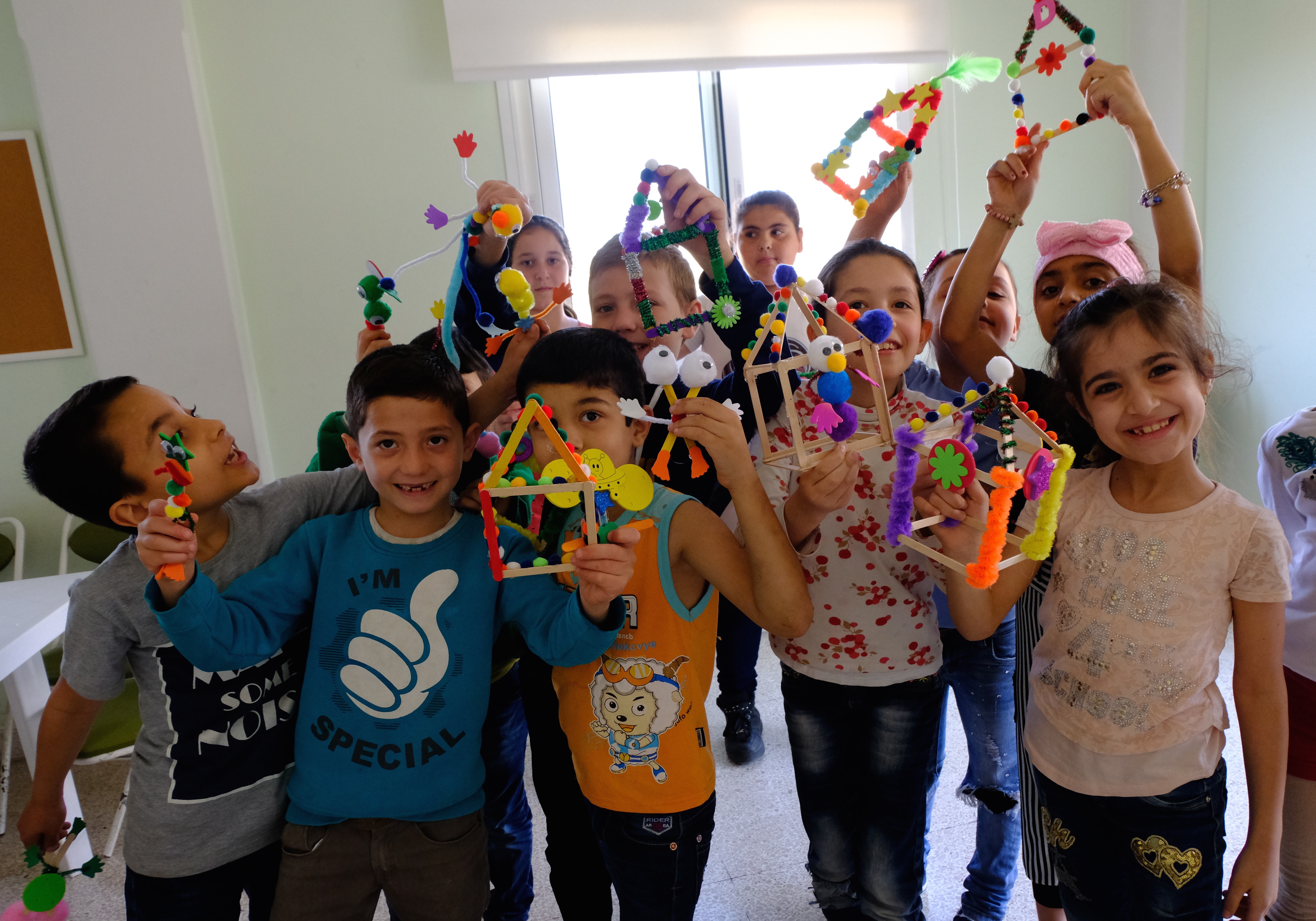 Engaging in crafts and puppet-play helps refugee kids develop their imaginations and begin to access and process difficult emotions.