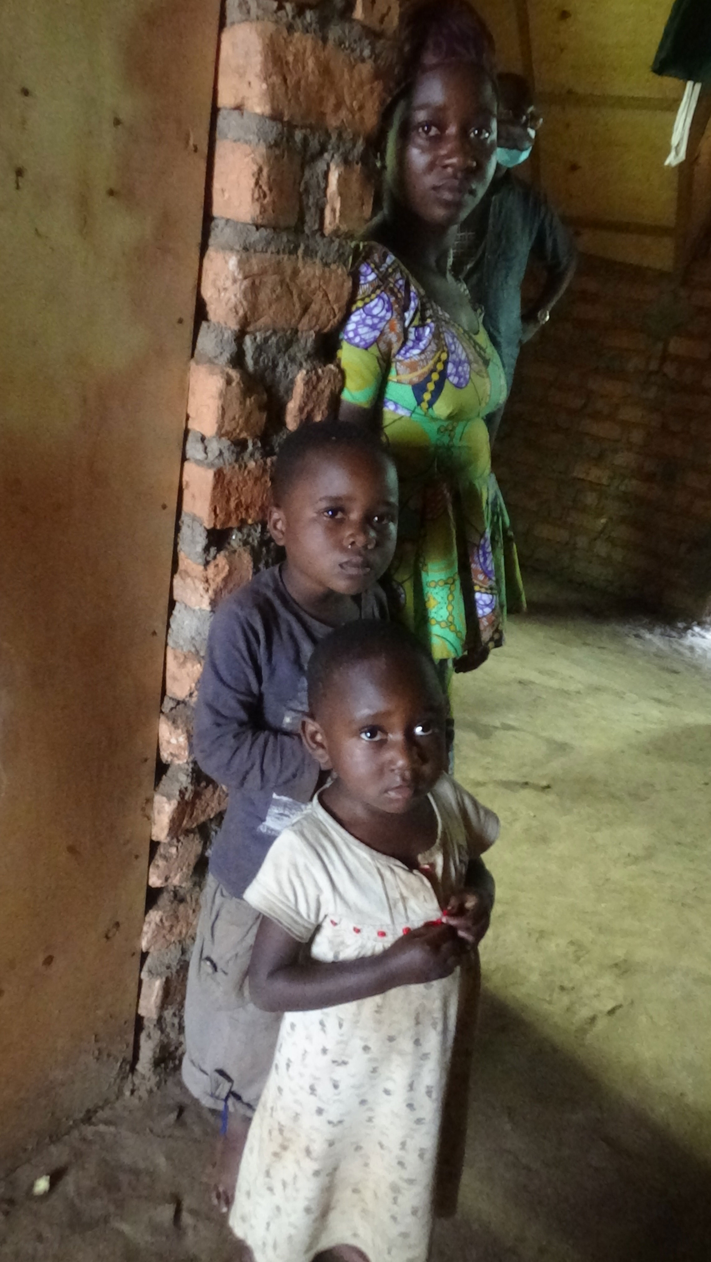 A displaced mother and her children shelter at a Protestant congregation in Bukavu.