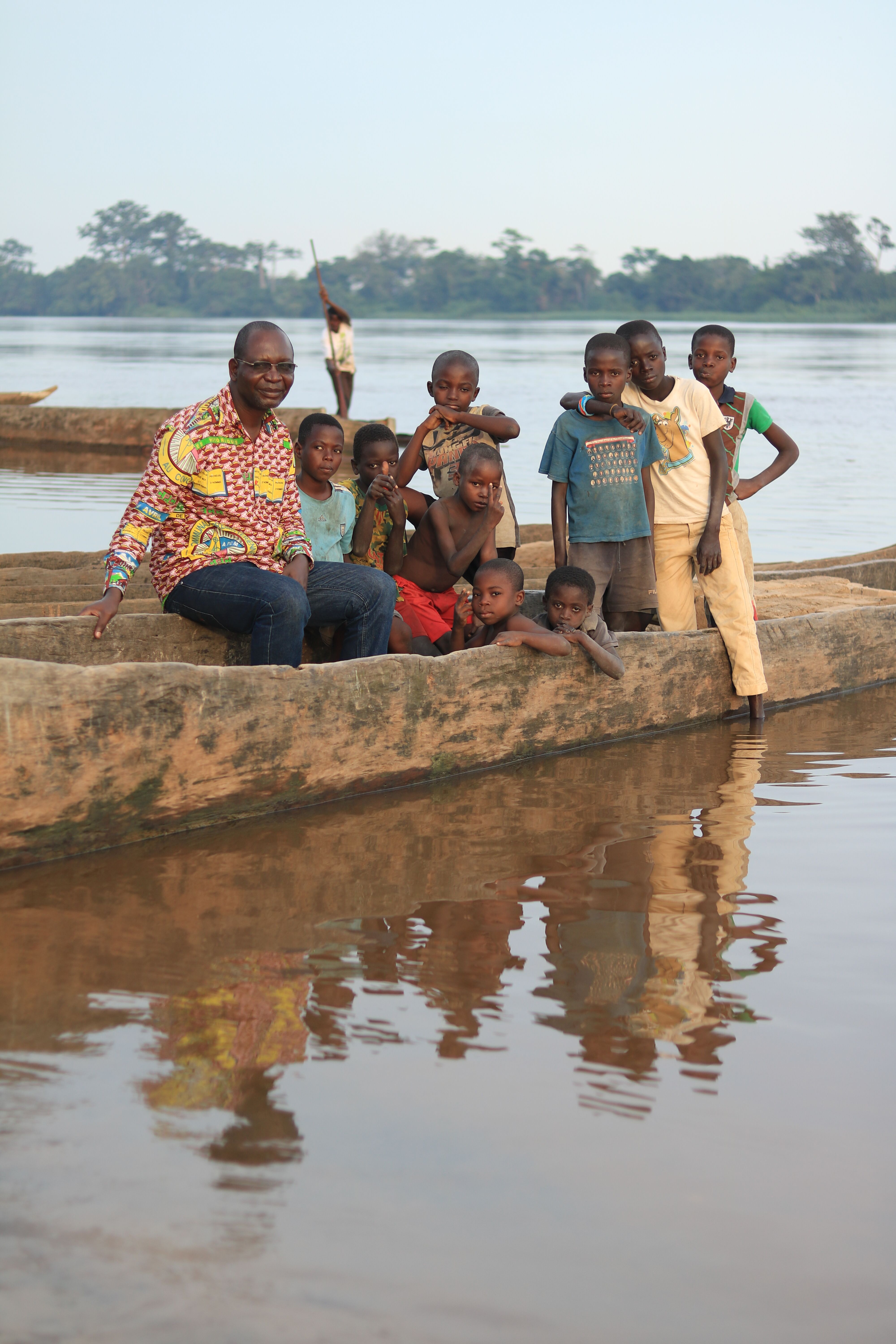 Pastor Isaac hanging out with kids at a river crossing on the way to Nioki.