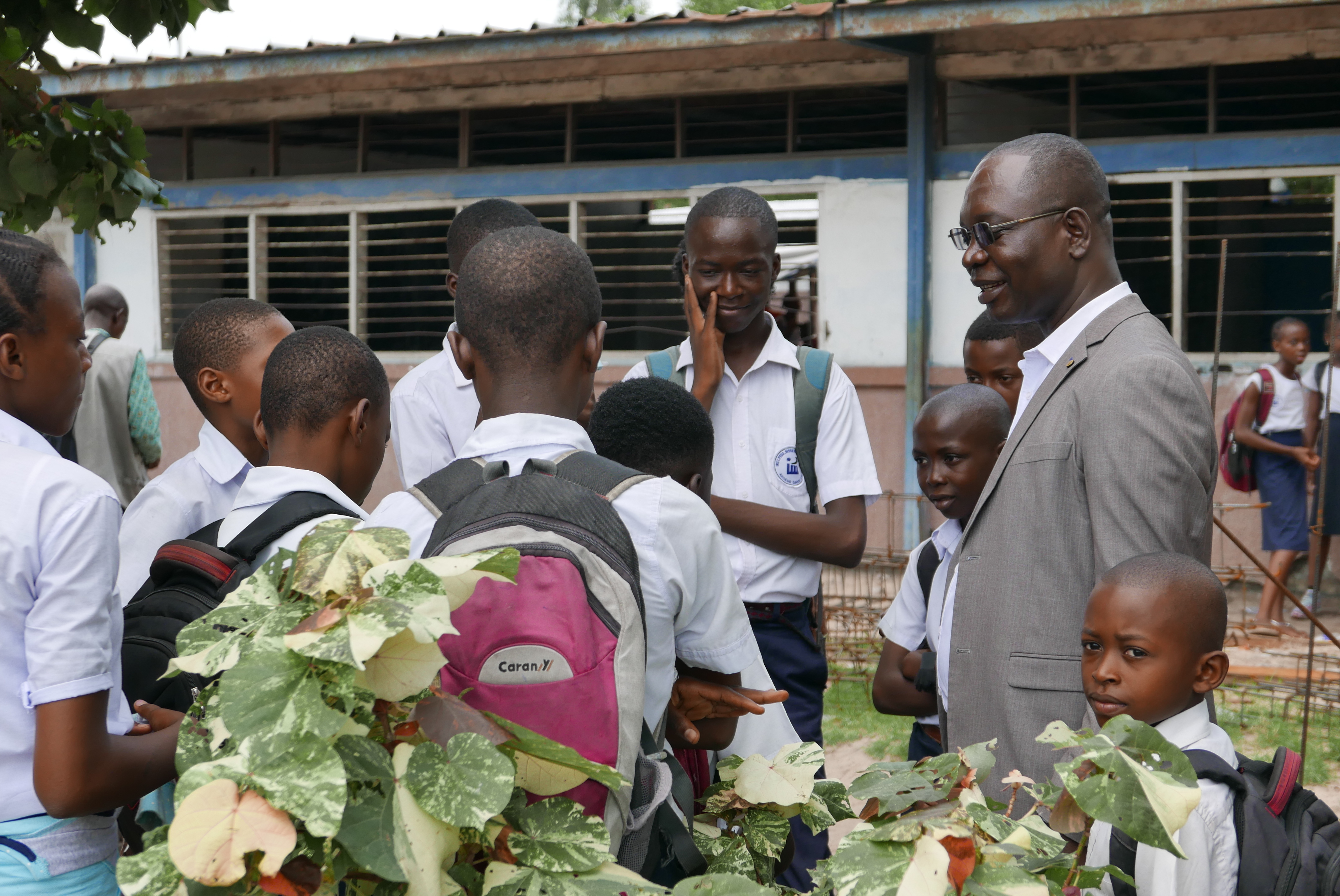 Pastor Isaac speaks with students at the school where he taught for over 15 years.