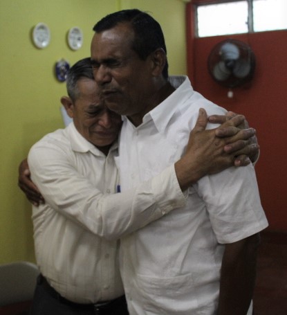 Nicaraguan pastors pray for each other during a crisis training.