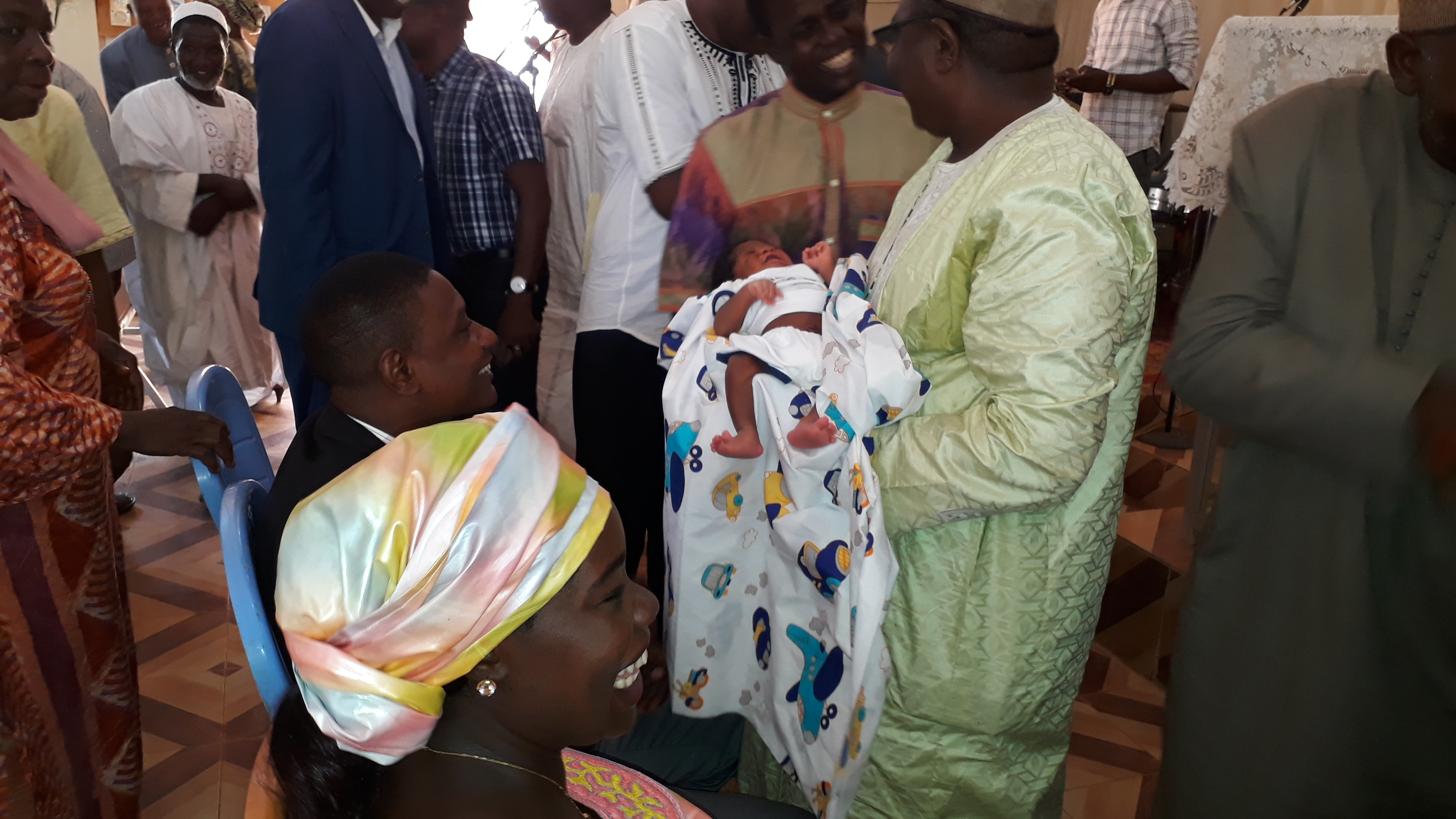 After Joshua’s naming ceremony, attendees congratulate the family.