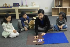 Eunbee Ham preaches to children at the Korean Central Presbyterian Church in Atlanta. She is one of many leaders who adapt or write curricula to fit the particular needs of their congregations. (Courtesy of Hyorim Kim)