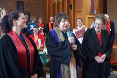 Lisa Larges (center) offers charge and blessing at the conclusion of her ordination service, Sunday, Oct. 30, 2016, with Kara Root and Mardee Rightmyer. (Photo by Emily Enders Odom)