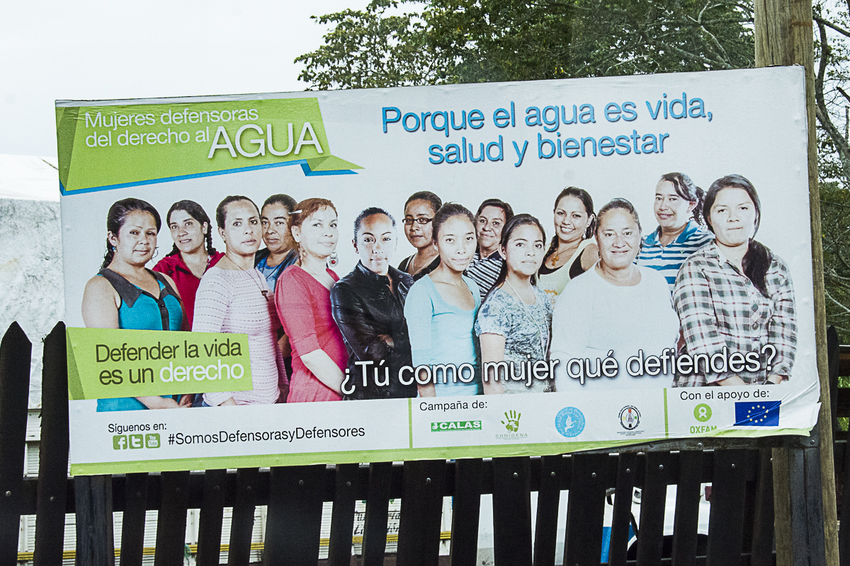 Billboard posted in the area impacted by the El Escobal mine. Women shown here are resistance leaders in their local communities: “Women defenders of the right to WATER” — “Because water is life, health and well-being” — “Defending life is a right” — “What do you as a woman defend?”