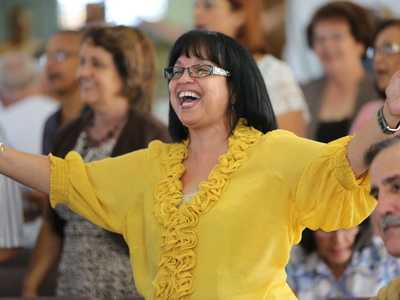 Women during worship service welcoming 1001 new worshiping communities to Puerto Rico