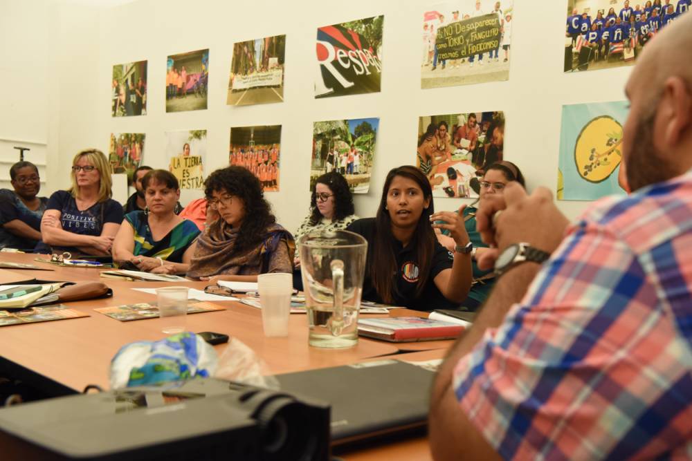 Representatives of organizations and initiatives associated with Fideicomiso de la Tierra del Caño Martín Peña meet with representatives from the Compassion, Peace & Justice ministries of the Presbyterian Mission Agency in San Juan, Puerto Rico. (Photo by Rich Copley)