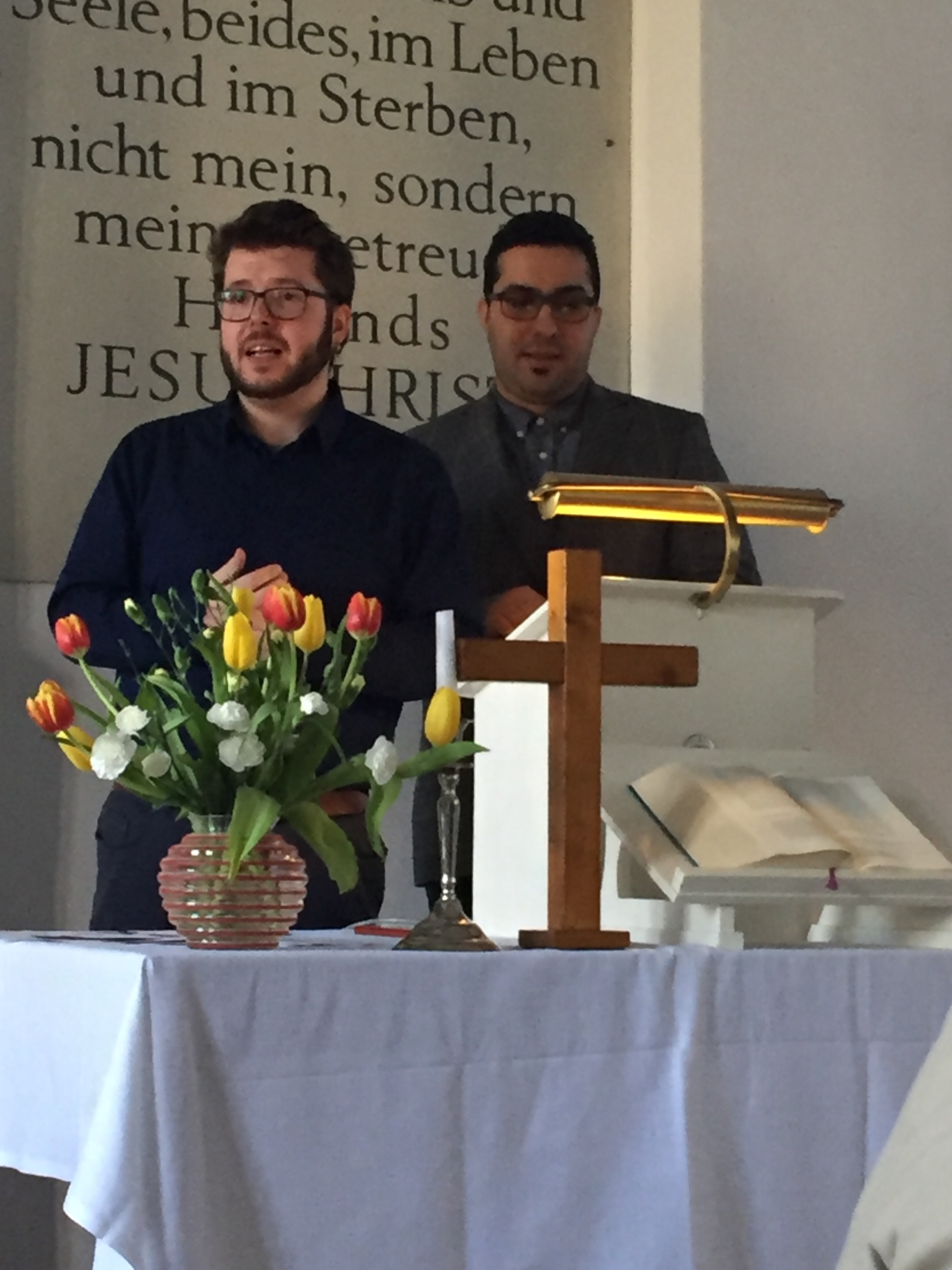German church intern and Javeed leading cultural exchange events.
