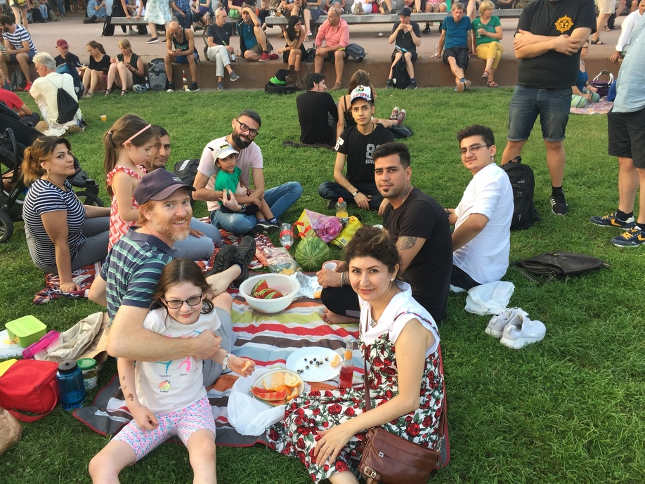 Enjoying a picnic together during the park fest