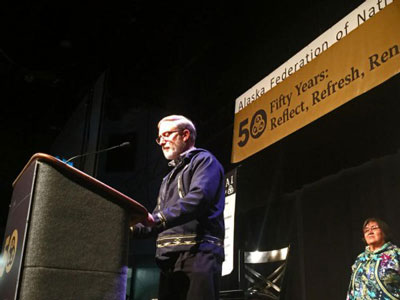 Curt Karns, executive presbyter of the Presbytery of Yukon, reads an apology before hundreds gathered October 22, 2016 for the Alaska Federation of Natives Convention in Fairbanks, Alaska. (Photo by Emily Schwing / Northwest News Network)