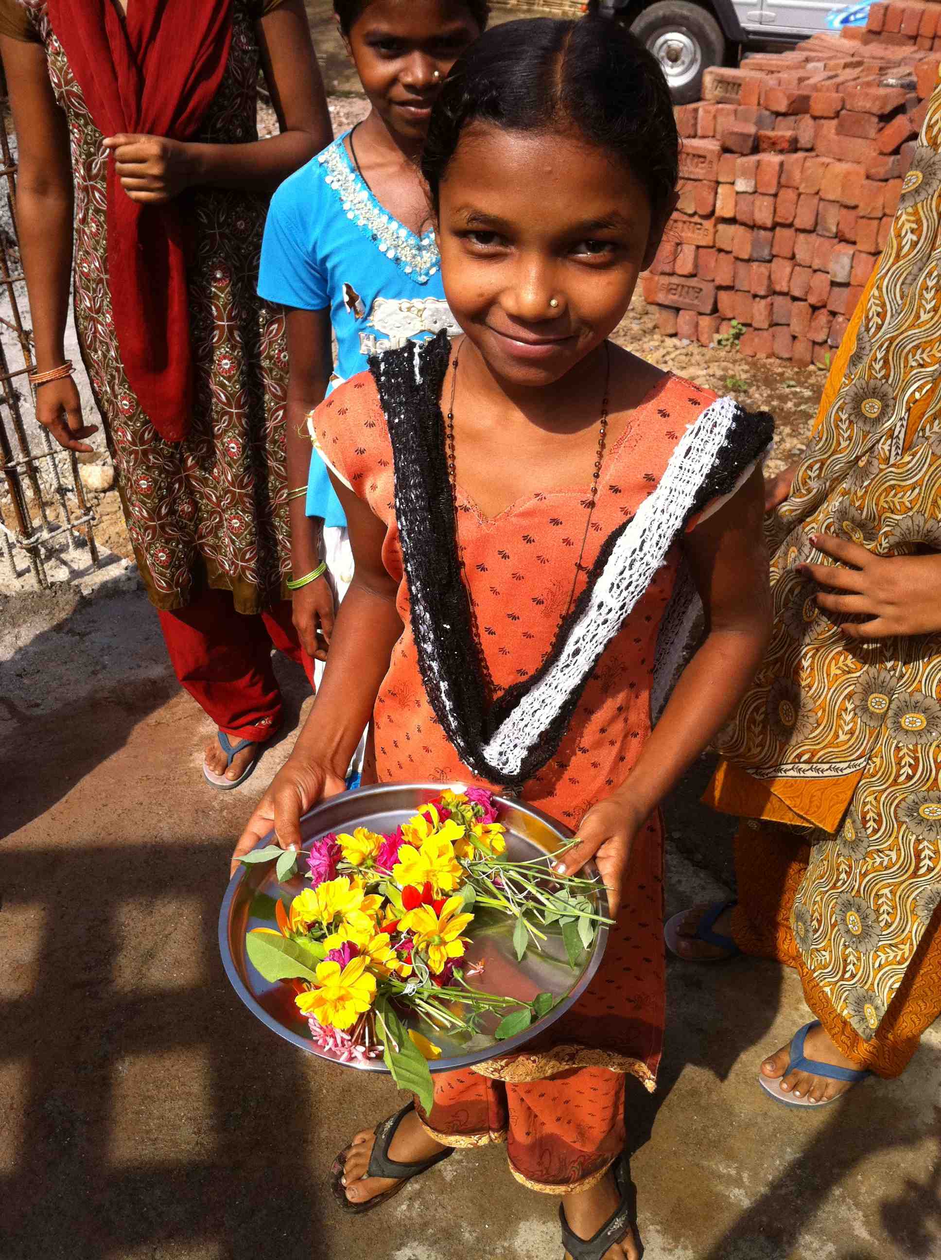 Indian girls holding flowers