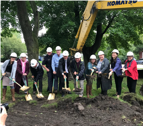 folks with shovels breaking ground for the new affordable units