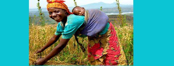 Woman farmer with baby on back