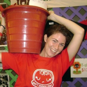 Dominique holding 35 pound bucket of tomatoes