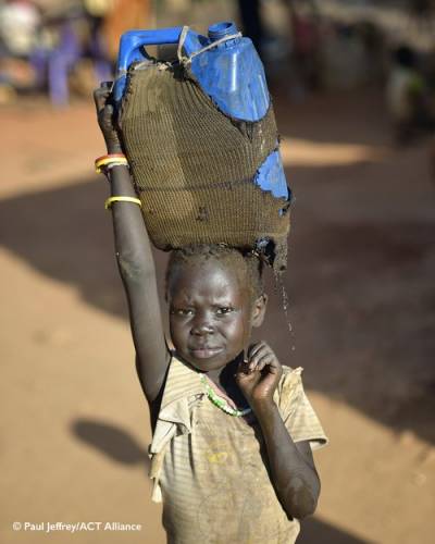 Boy carrying clothes