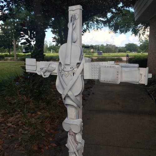 Cross made from broken and empty objects