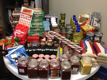 A holiday food collection by Magdalena Garcia's hospice team to benefit families in need in their care area