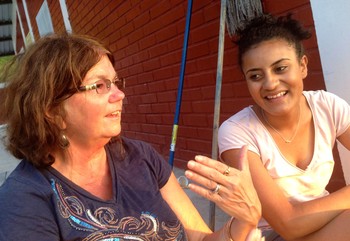 Roberta Updegraff, left, speaks with a youth at the Honduran orphanage Hogar de Niños Renacer.