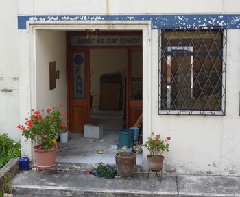An orphanage in Quito lies in ruins due to financial crisis. The welcome sign over the main door featured the institution's slogan: "Love is giving a future."