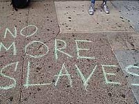 No more slaves written on sidewalk