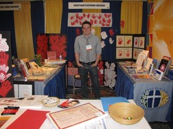 The Peacemaking Program booth with Red Hand Campaign materials