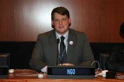 Ryan Smith, Presbyterian Representative to the United Nations, prepares to speak to the 59th Session of the UN Commission on the Status of Women.