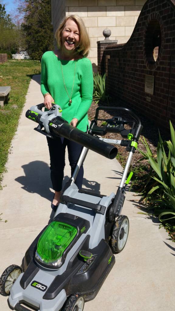 Woman with lawn mower