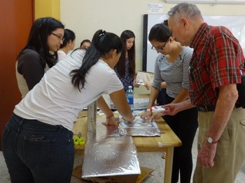 Chuck Dow helps teach solar cooking