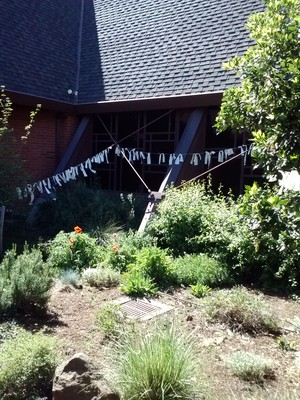 prayer flags hanging outside FPC Palo Alto
