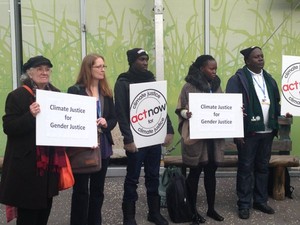 Gender Justice and Climate Justice signs