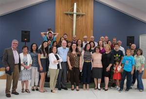 Tim McCalmont (center left) with the Syrian congregation following their Arabic speaking Easter season worship. He says he is grateful to God for ‘dropping what has become a life of its own into his church’s lap.’ —Courtesy Presbyterian Church of the Covenant