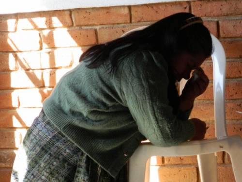 Juana Herlinda praying for her son Gonzalo's well-being